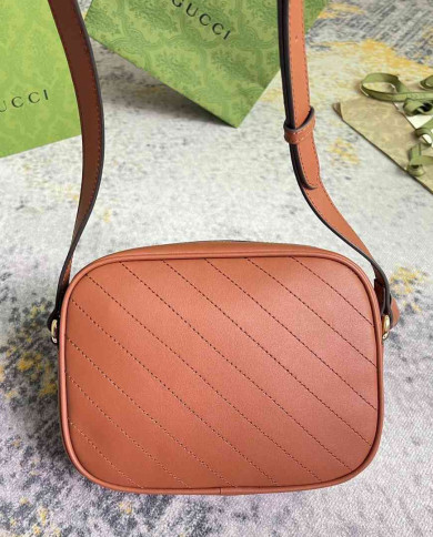 Gucci GG Embossed Leather Camera Bag with Tassel