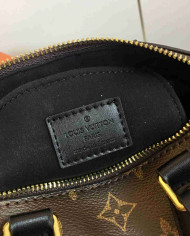 LV Embossed Top Handle Crossbody Bag